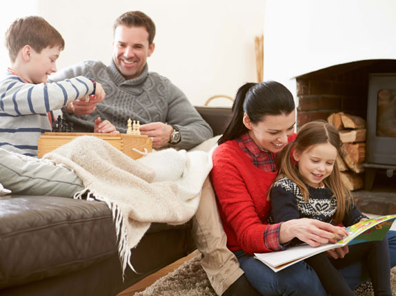 family smiling in living room